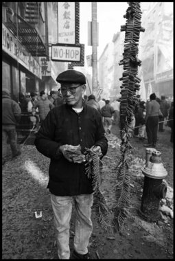 Old Man Holding Fire Crackers